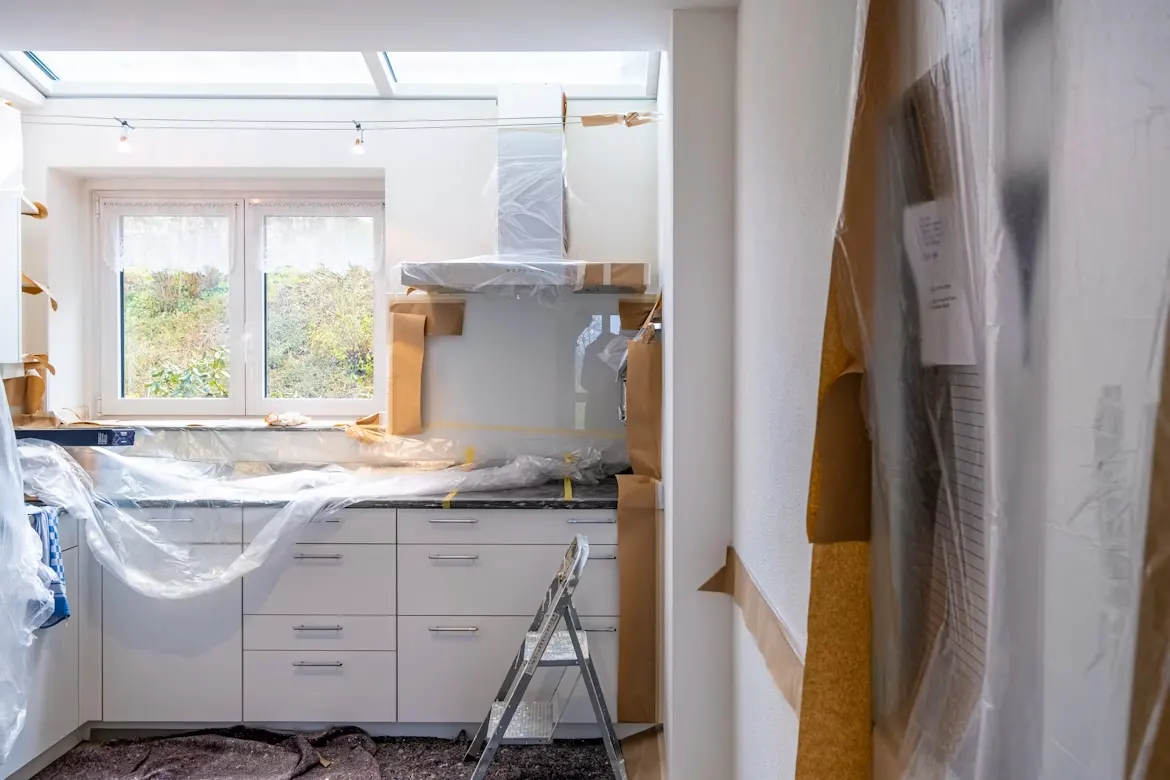 White wooden cabinet near window during renovations