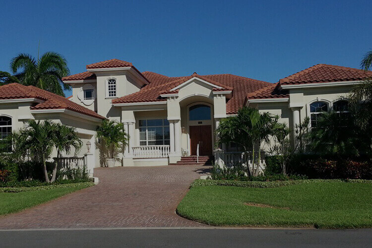 Exterior of two-story stucco home custom built by Rose Building