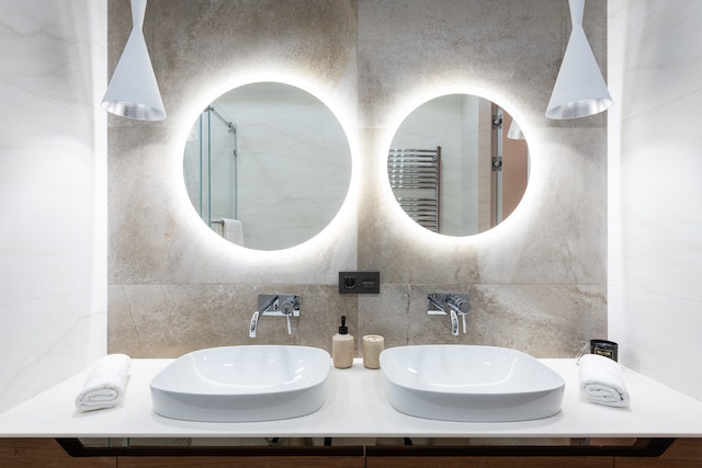 pexels-max-vakhtbovych-6186825.jpgLights behind round bathroom mirrors