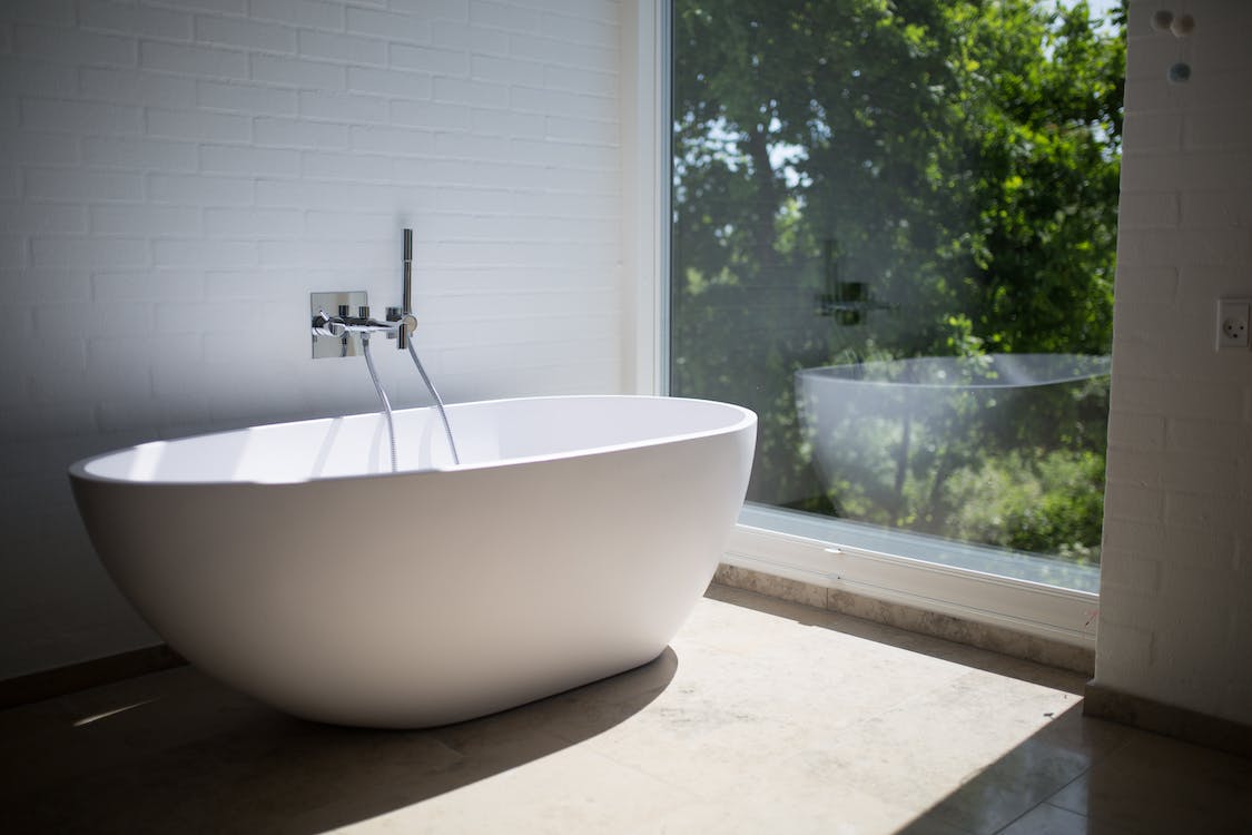 Free White Ceramic Bathtub Beside Clear Glass Wall Stock Photo