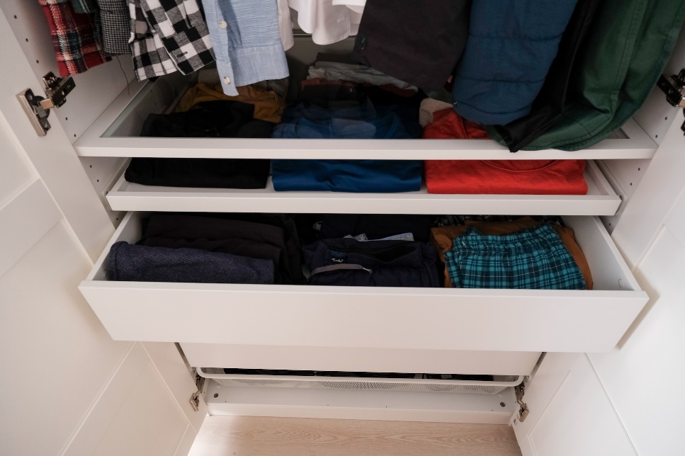 A closet with a lot of drawers