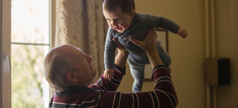 An older man with a baby