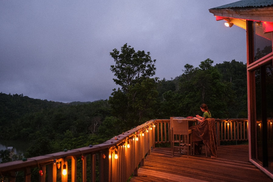 A porch lit up by lights