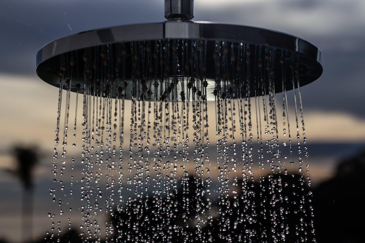A close-up shot of a shower head, adding to the spa-worthy shower experience at home.