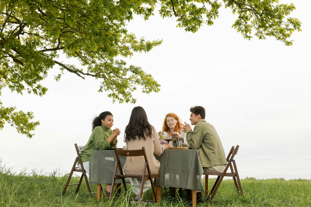 Friends talking together and eating food