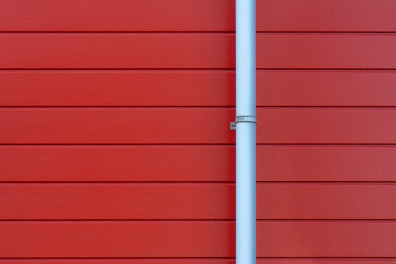 Rain gutter on a red wall