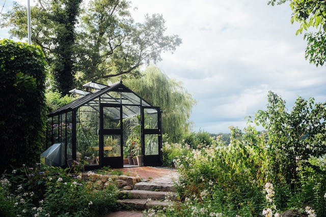 a greenhouse in a garden