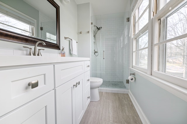 A bathroom with a lot of storage.