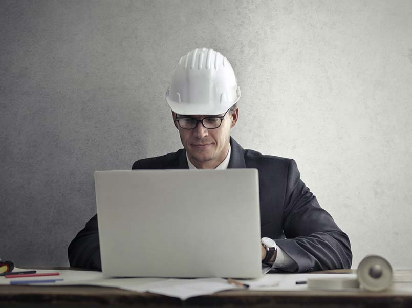 An engineer using a laptop.