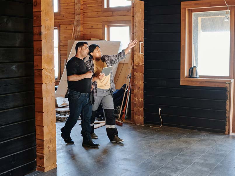 An architect showing a new house to a client.