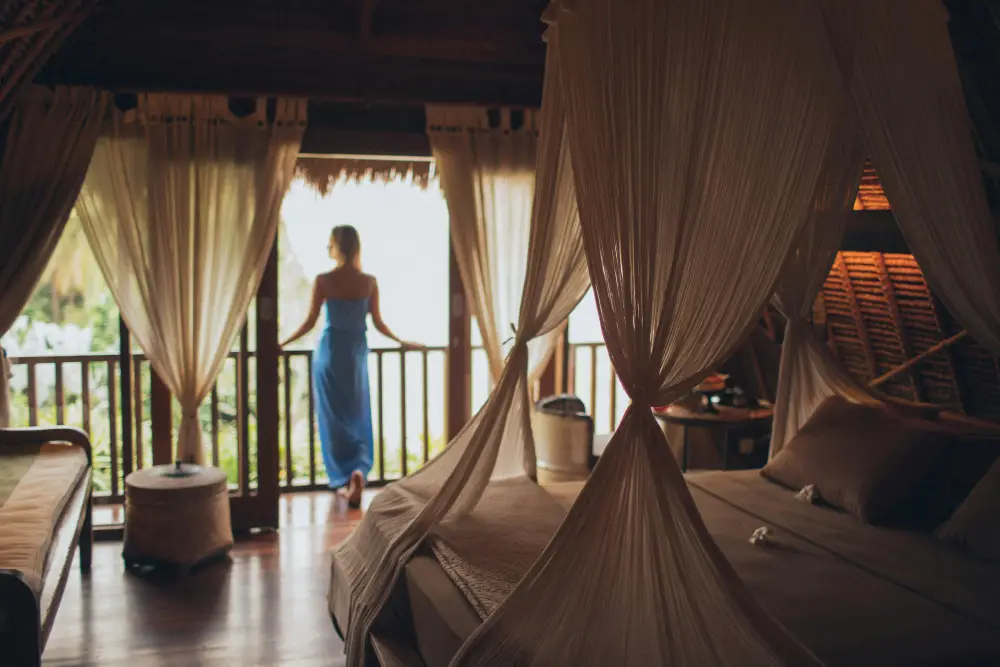 Woman leaning on a balcony handrail