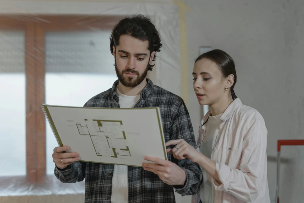 A couple looking at a floor plan