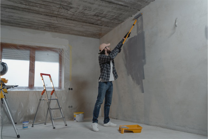 man painting wall 