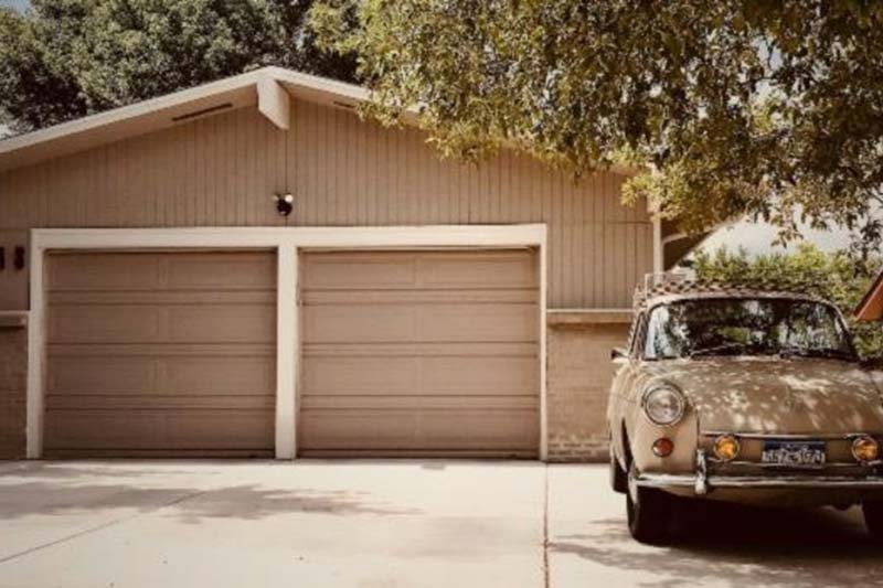 A large garage next to a home