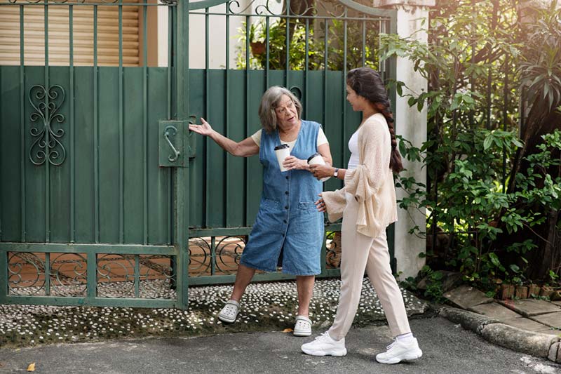 An older woman showing how much of a difference revamping your front entrance can make.