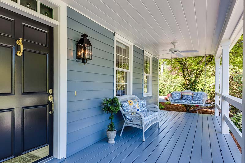 Deck of a blue and white house.