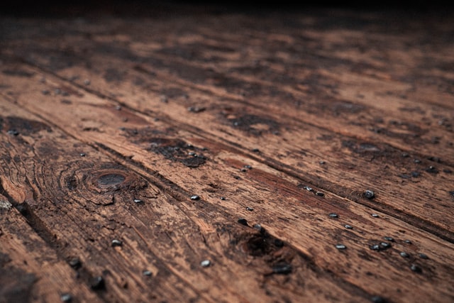 Water droplets on an old wooden floor