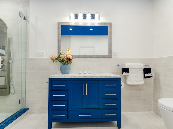 A bathroom with fixtures placed above the mirror