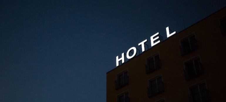 A glowing sign that spells Hotel