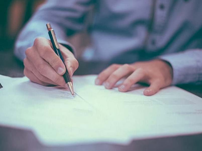 Man writing on paper